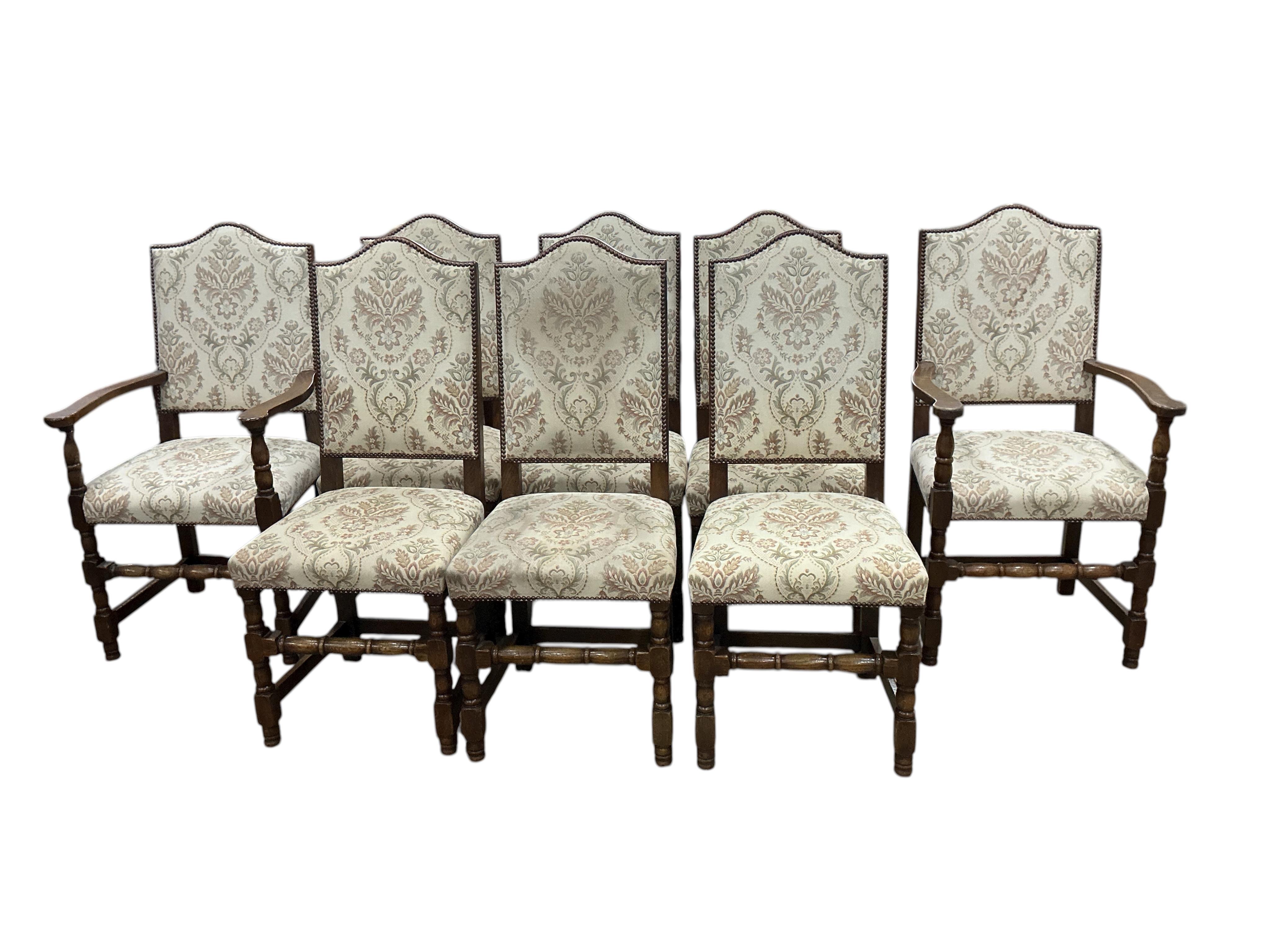 A set of eight 18th century style upholstered oak dining chairs, two with arms